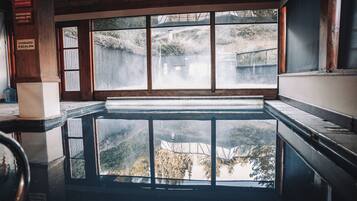 Relax by the pool surrounded by a serene view of the surrounding landscape.