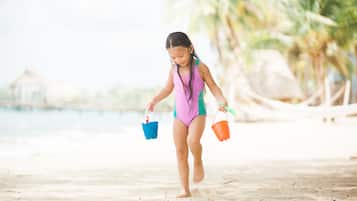 Enjoy a family-friendly beach vacation with access to the ocean and scenic palm trees.