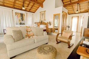 Colonial Penthouse | Living area | 42-inch LCD TV with cable channels, TV - Almond Beach Resort at Jaguar Reef (Hopkins)