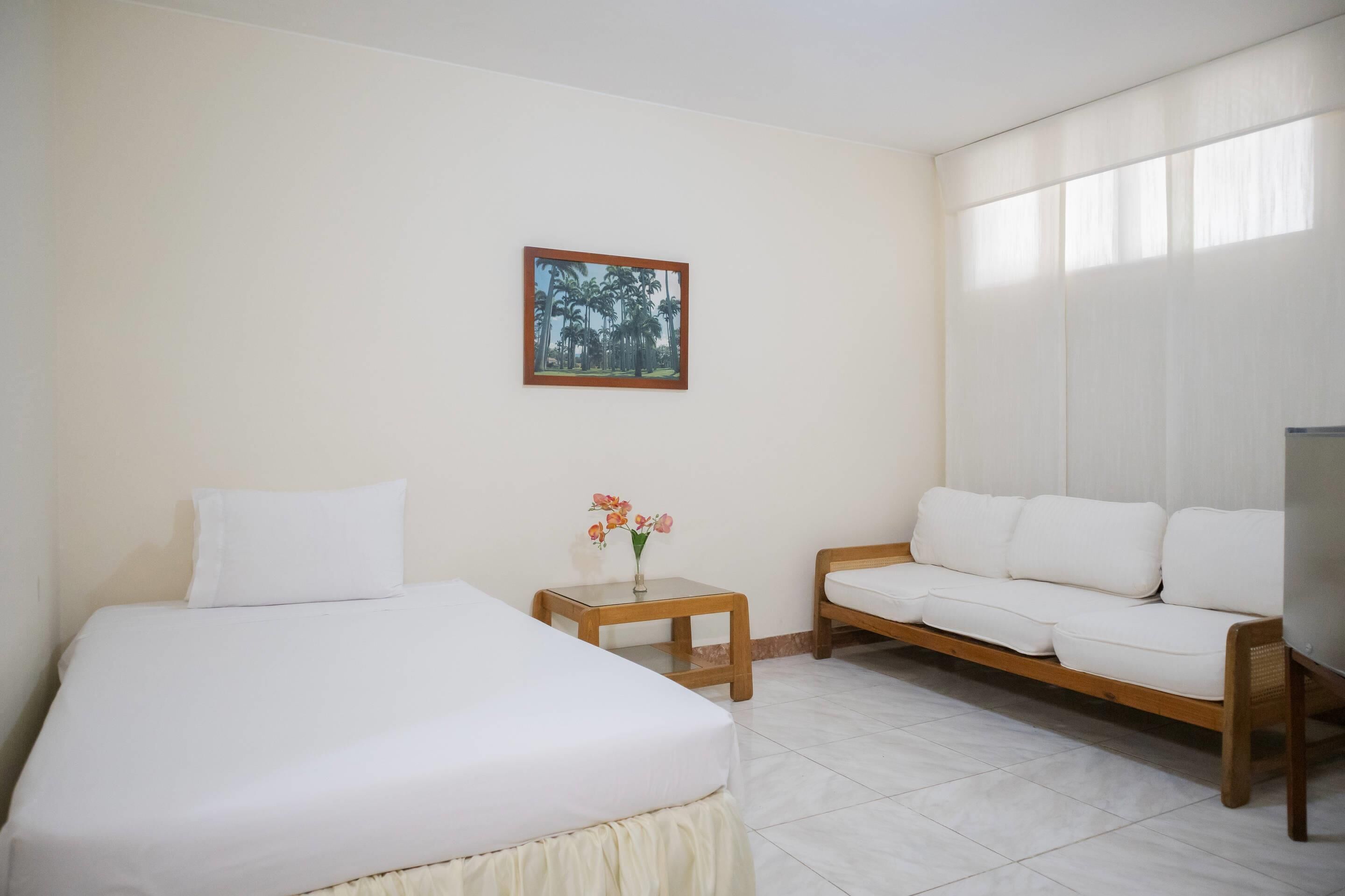 Standard Room, Multiple Beds, Non Smoking | Premium bedding, minibar, in-room safe, free WiFi