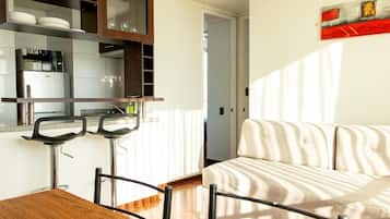 Family Apartment | Living area | 24-inch flat-screen TV with cable channels, TV
