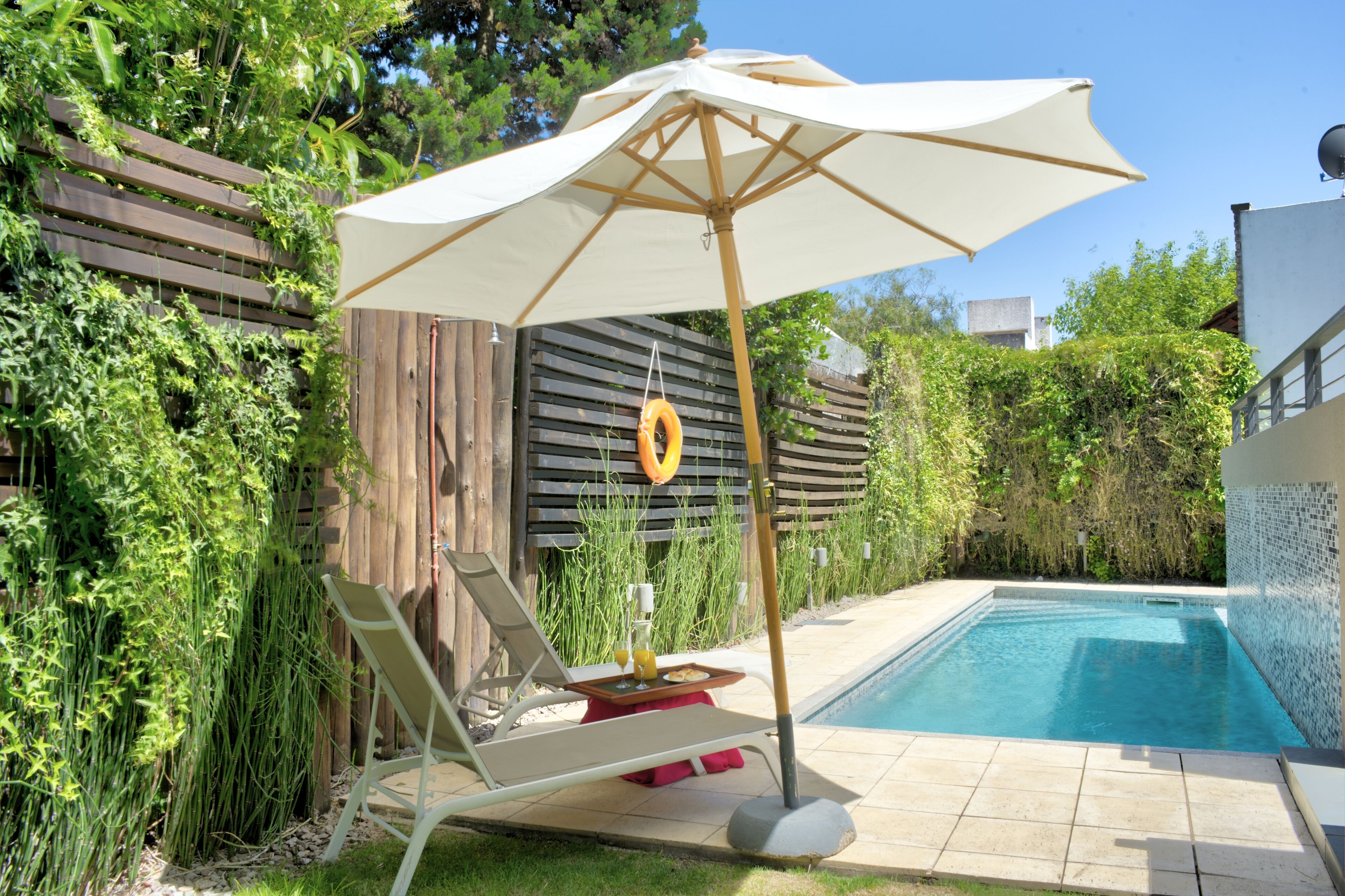 outdoor pool, pool umbrellas, pool loungers