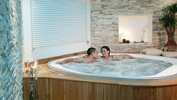 Banheira de hidromassagem, massagens com pedras quentes