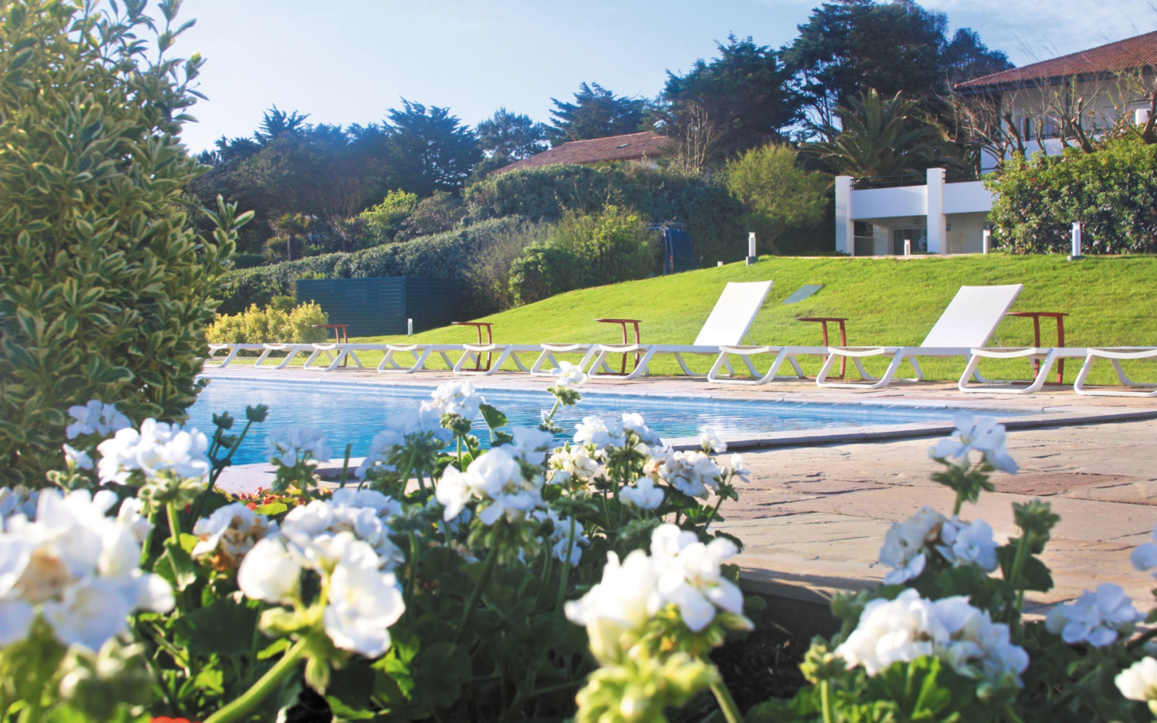 seasonal outdoor pool, pool umbrellas, pool loungers