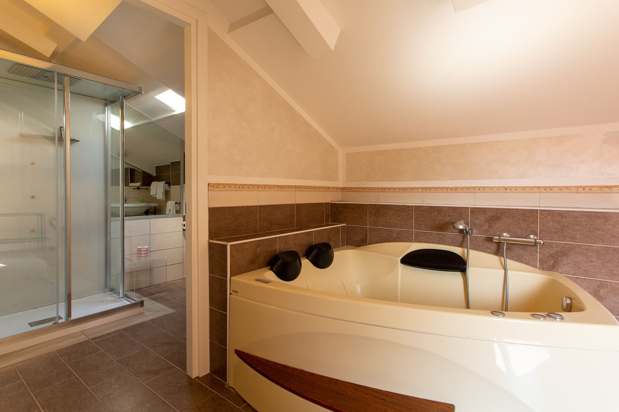 deluxe suite | bathroom | rainfall showerhead, free toiletries, hair dryer, bidet