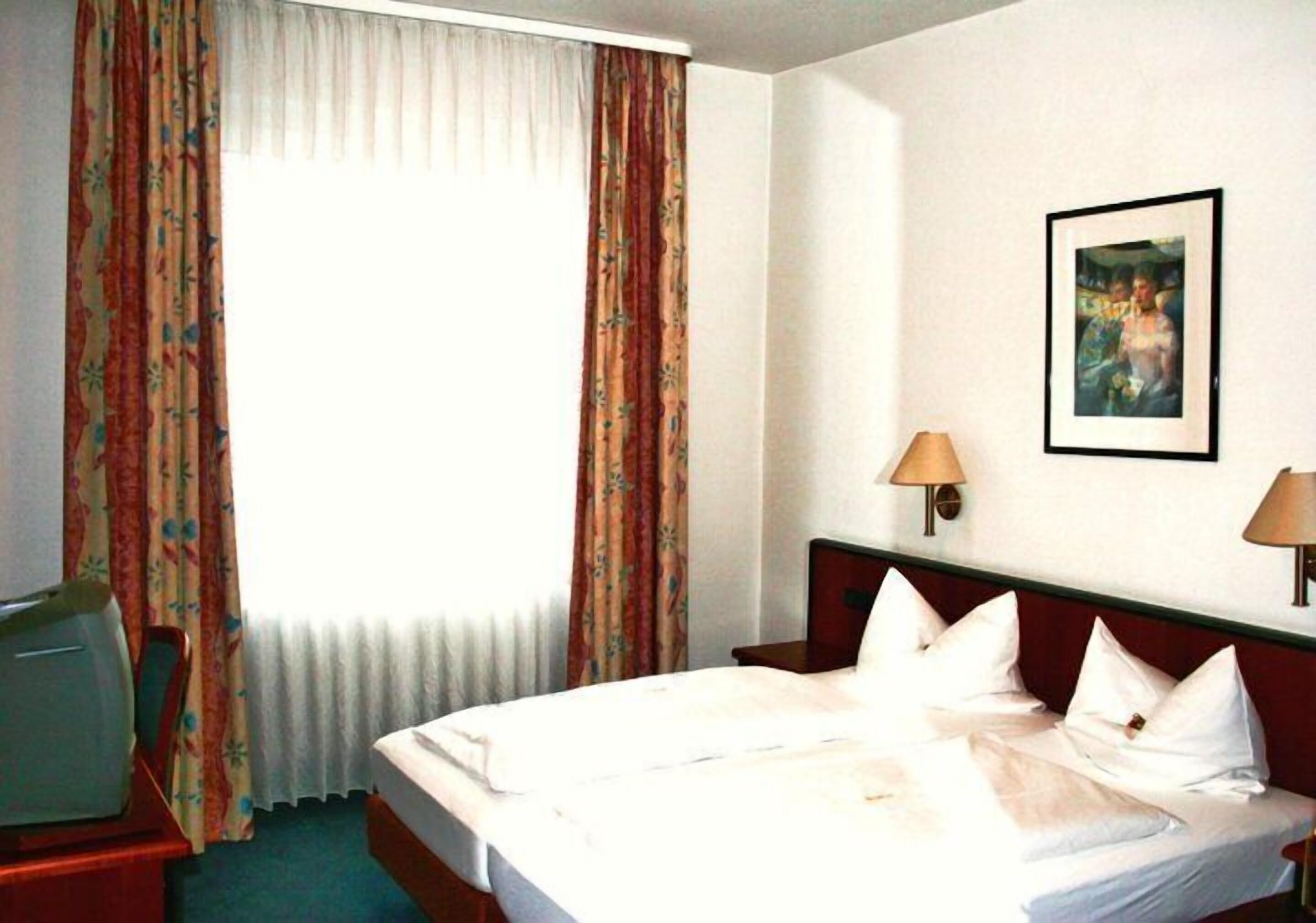 Minibar, desk, laptop workspace, blackout curtains