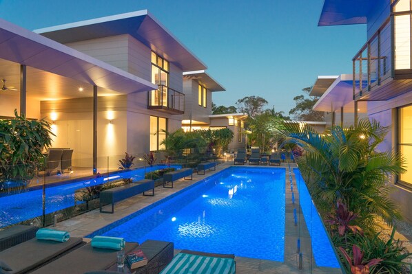 Outdoor pool, a heated pool, pool loungers - Byron Luxury Beach Houses (Byron Bay)