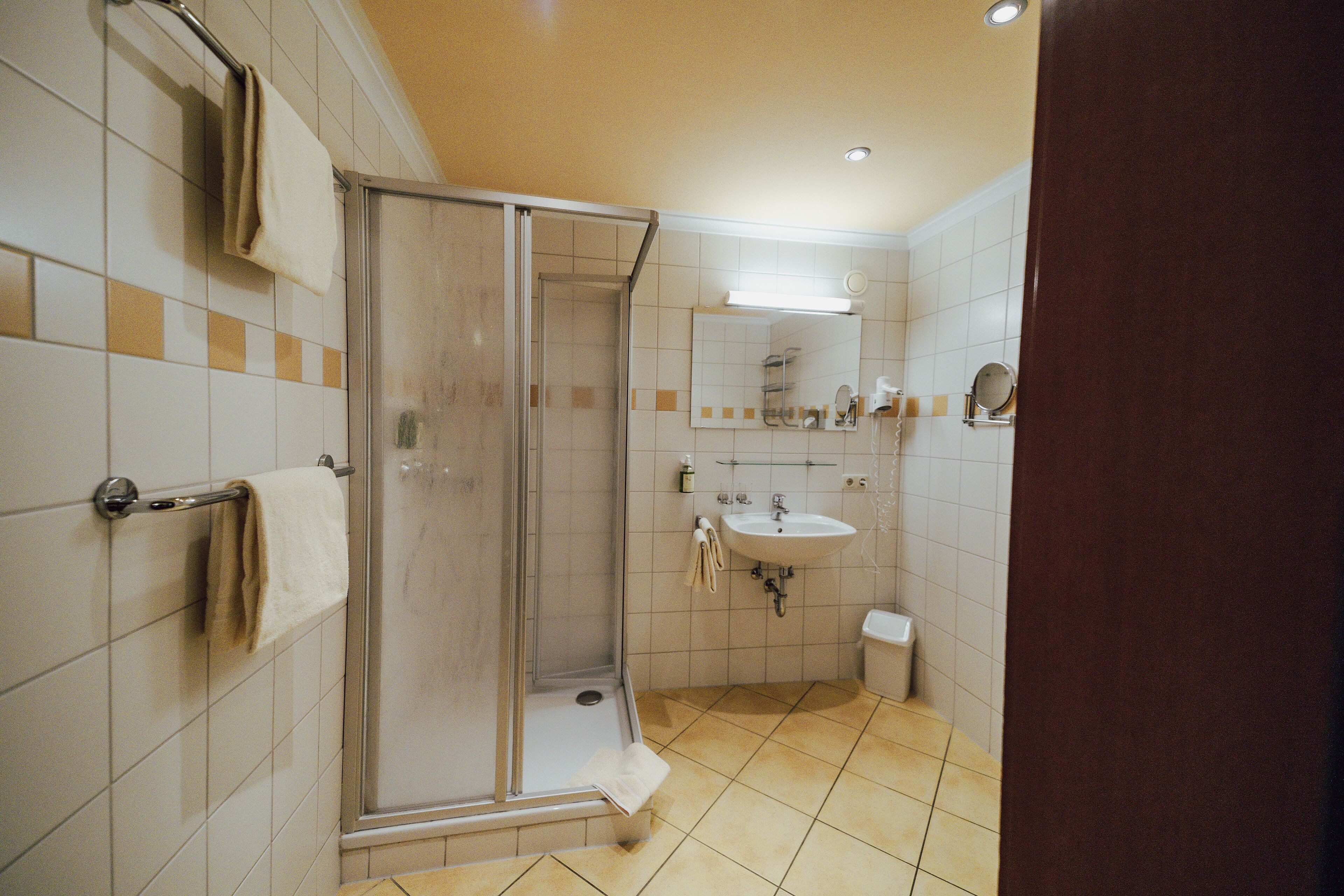 shower, hair dryer, bathrobes, towels