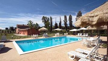 Outdoor pool, open 9 AM to 7 PM, pool umbrellas, sun loungers