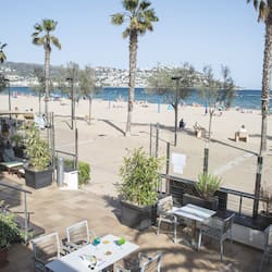 On the beach, sun loungers, beach volleyball