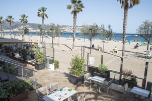 On the beach, sun loungers, beach volleyball