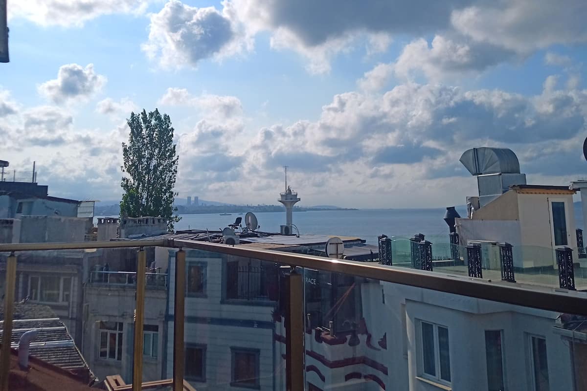 Deluxe Triple Room, Balcony, Sea View | 2 bedrooms, premium bedding, pillow-top beds, minibar