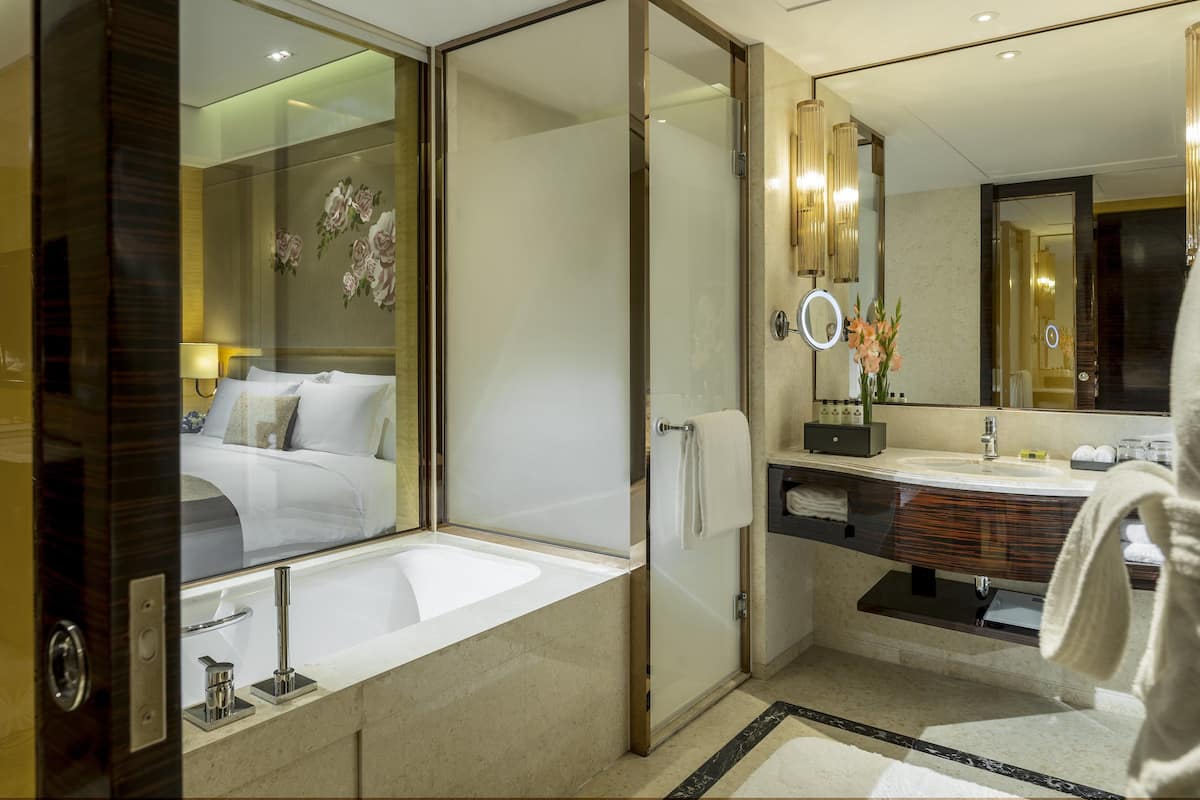 separate bathtub and shower, rainfall showerhead, designer toiletries