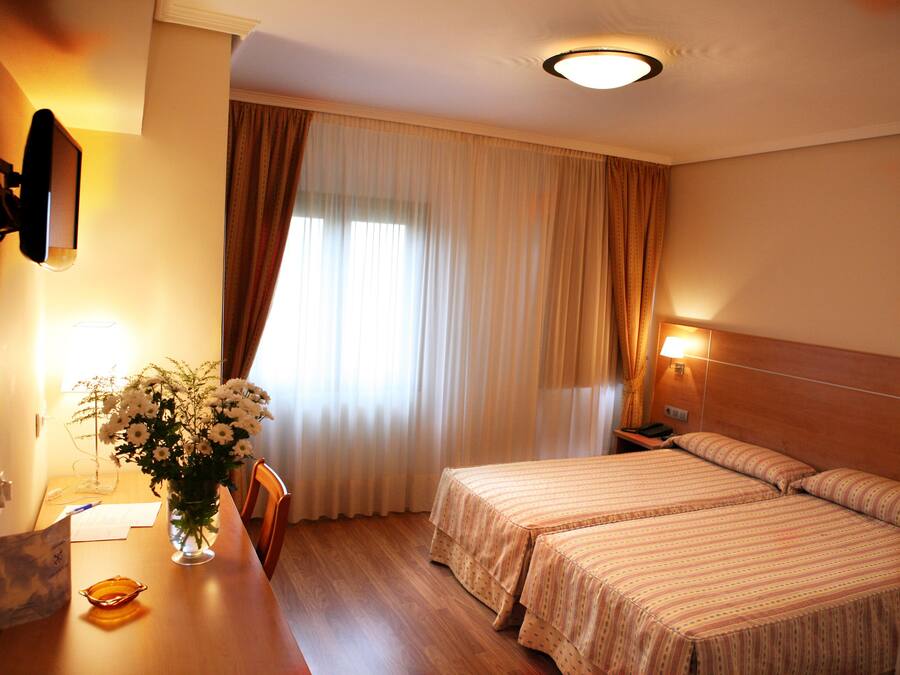 Standard Double Room | Minibar, in-room safe, desk, blackout drapes