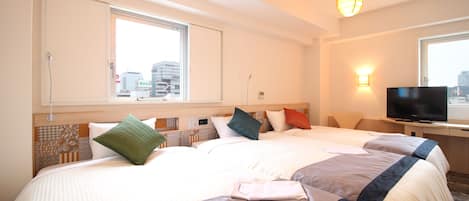 Deluxe Twin Triple Room, Non-smoking | Desk, blackout curtains, iron/ironing board, free WiFi
