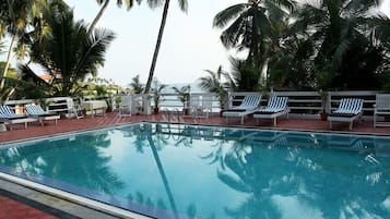 Outdoor pool, pool umbrellas, sun loungers