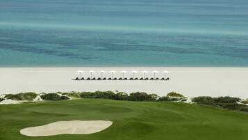 Enjoy a serene ocean view from the adjacent golf course, where you can relax or sunbathe on the beach.