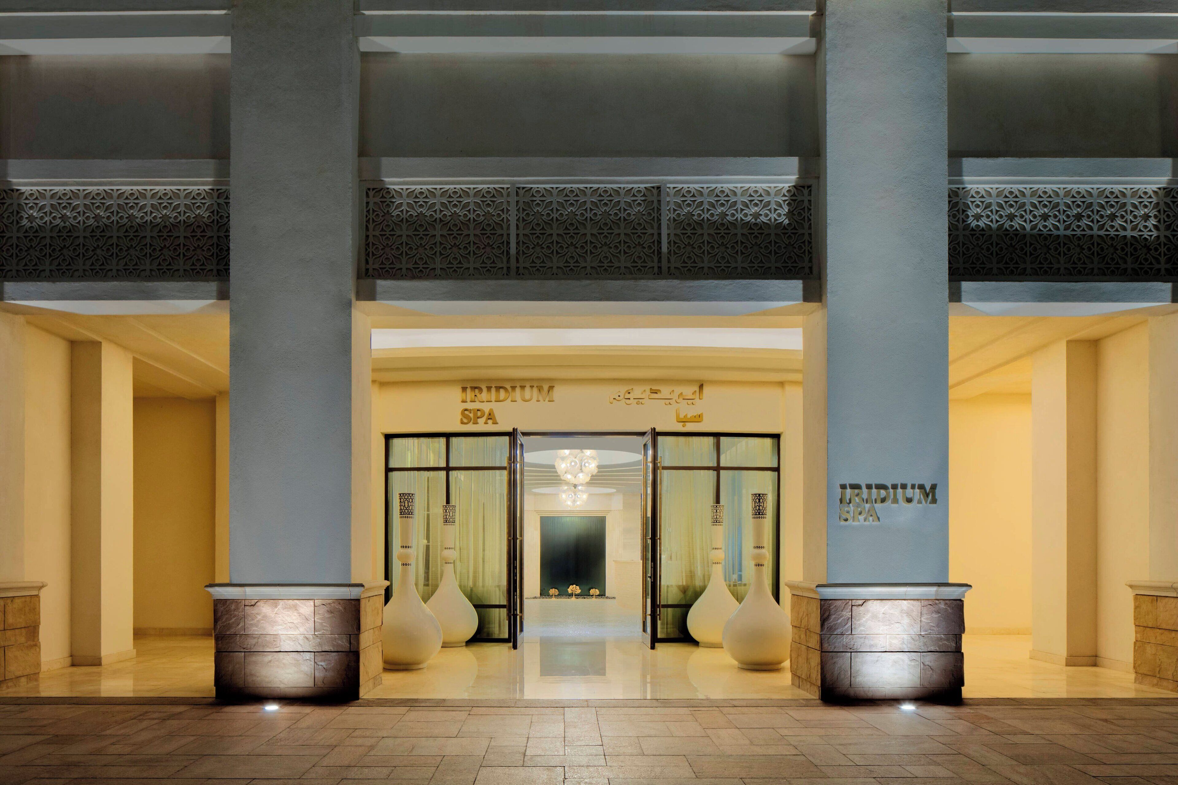 A hotel entrance with a sign reading "IRIDIUM SPA".