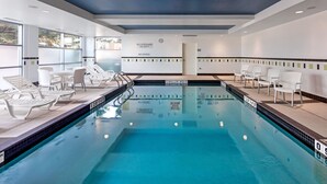 A swimming pool with lounge chairs and a sign indicating shallow areas. - Fairfield Inn & Suites by Marriott Toronto Mississauga (Mississauga)