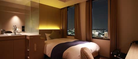 Down duvets, desk, laptop workspace, iron/ironing board