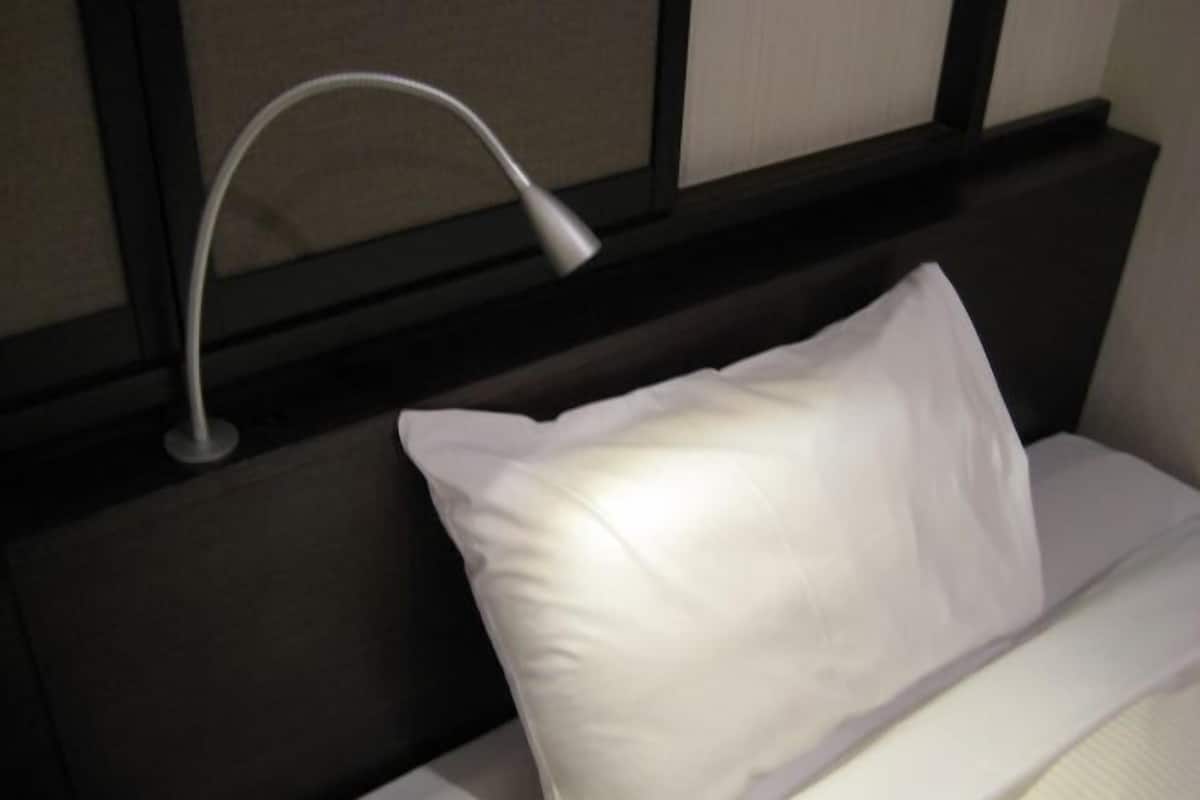 Down duvets, desk, laptop workspace, iron/ironing board