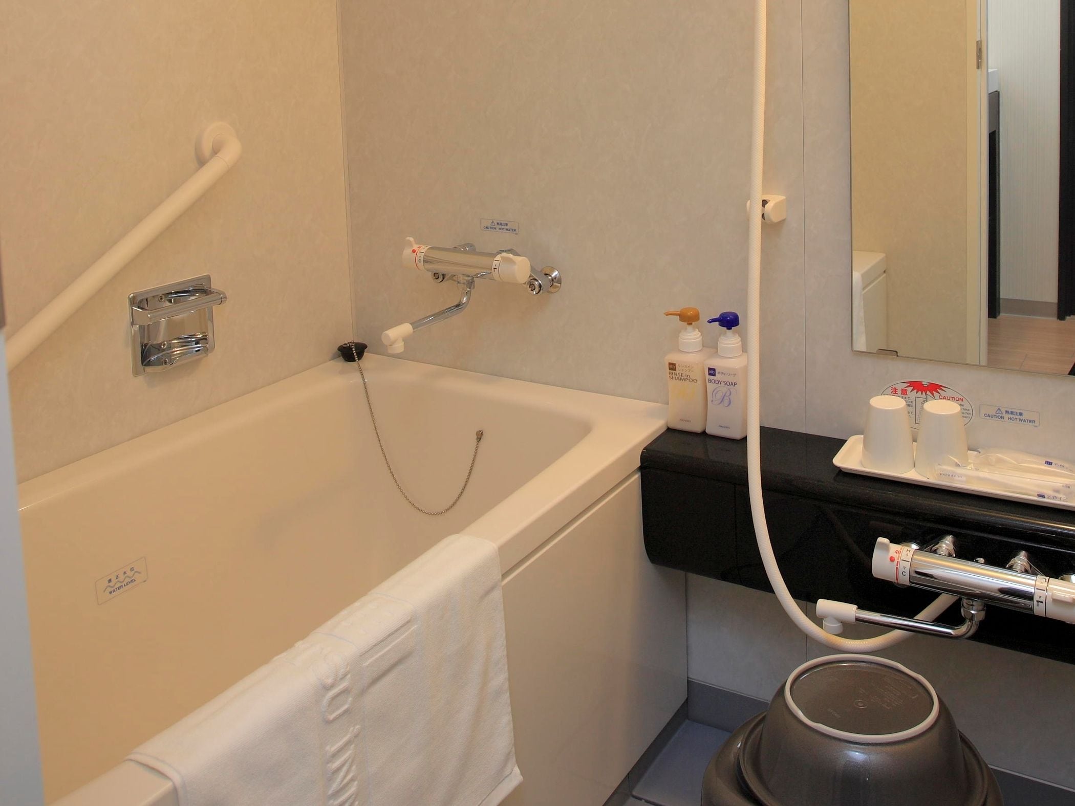 hair dryer, slippers, electronic bidet, towels