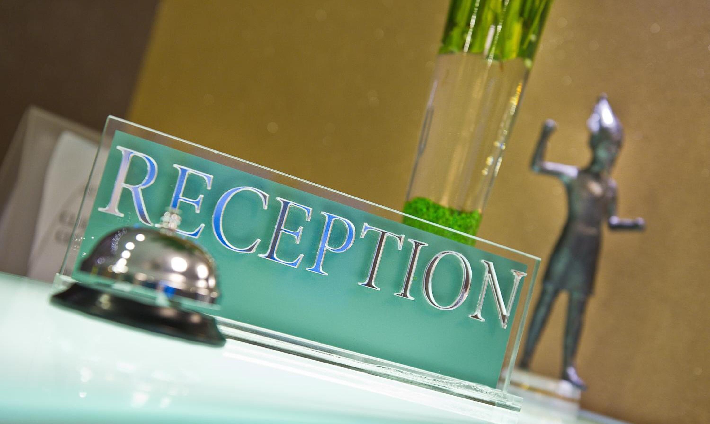 A reception sign with the word "RECEPTION" in large letters.