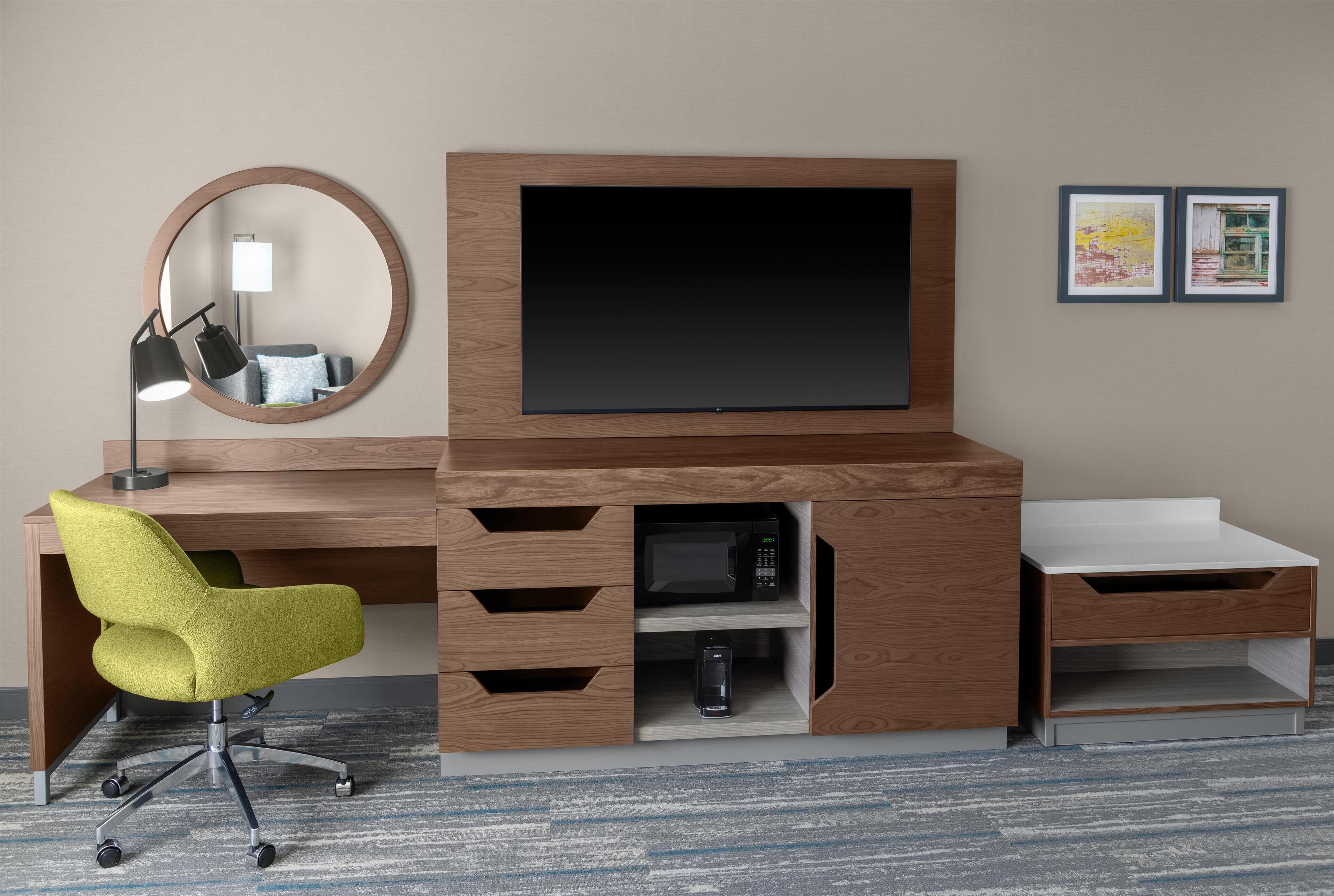 Desk, laptop workspace, iron/ironing board, free cribs/infant beds