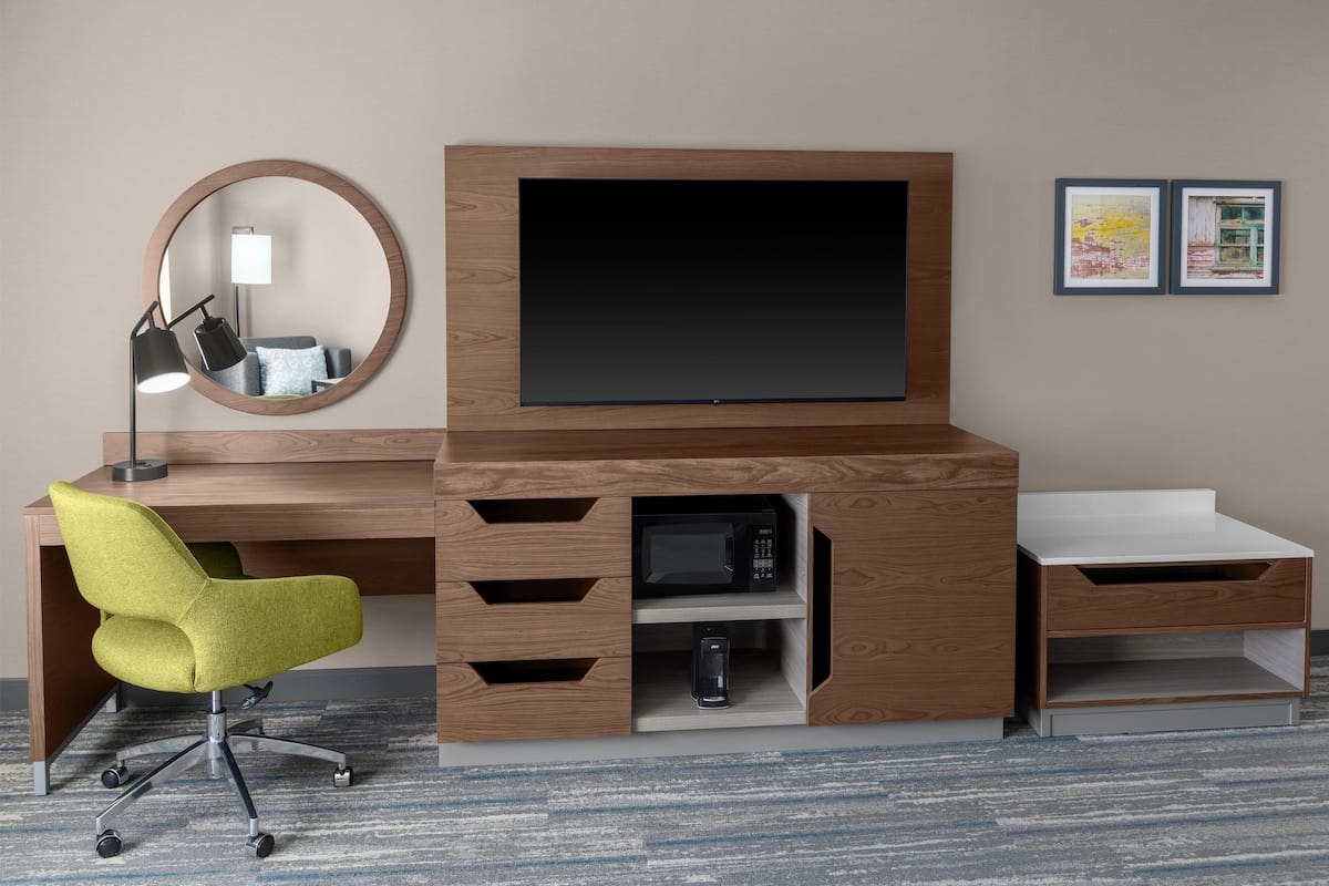 Desk, laptop workspace, iron/ironing board, free cribs/infant beds