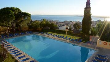 Outdoor pool, open 10:00 AM to 8:00 PM, pool umbrellas, sun loungers