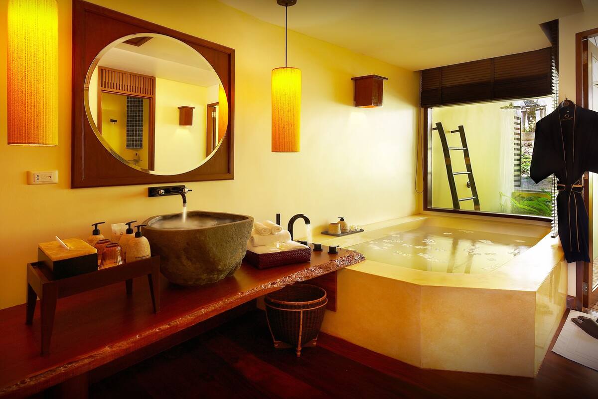 supreme deluxe | bathroom | separate bathtub and shower, rainfall showerhead, designer toiletries