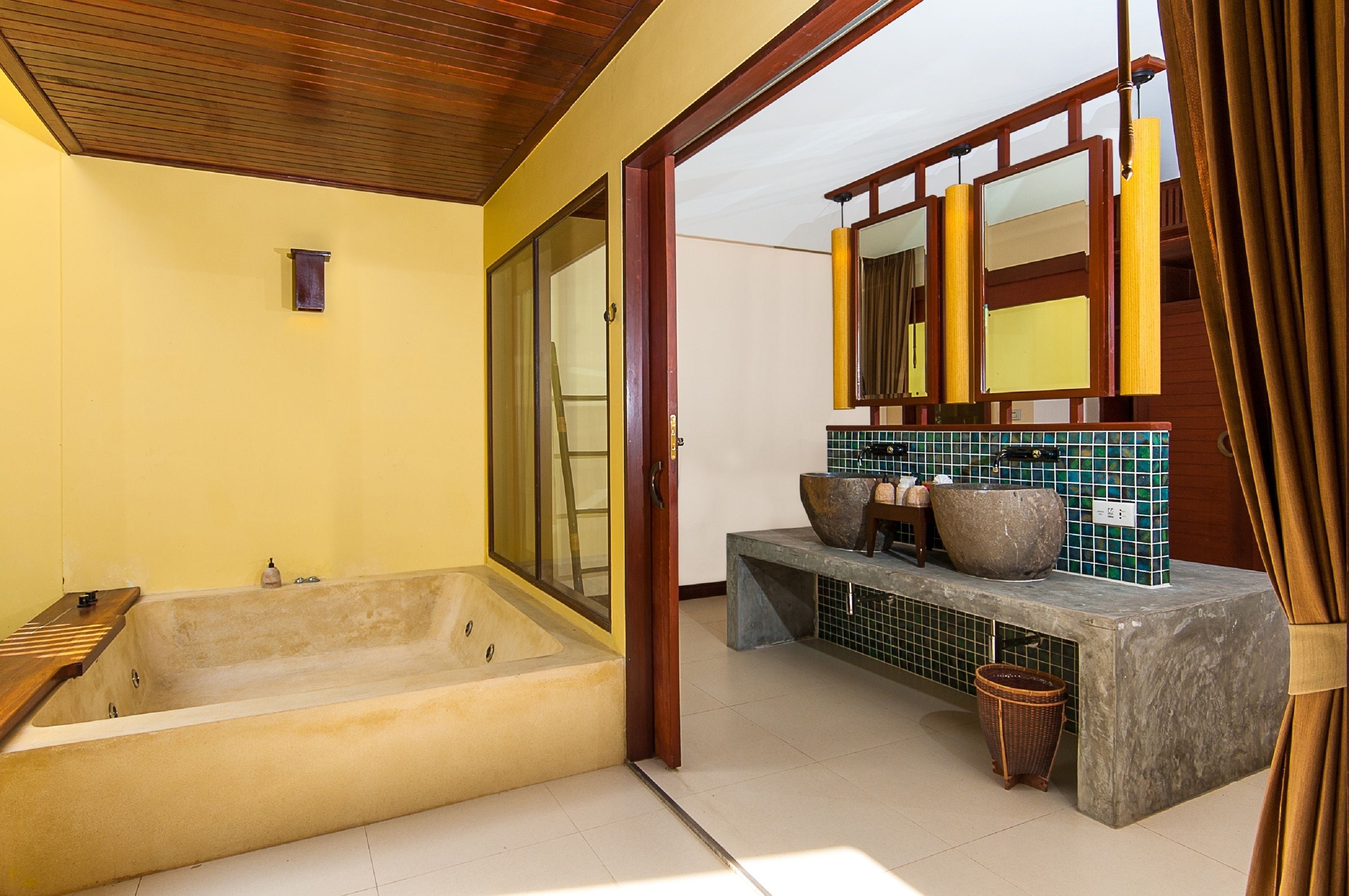 family room | bathroom | separate bathtub and shower, rainfall showerhead, designer toiletries