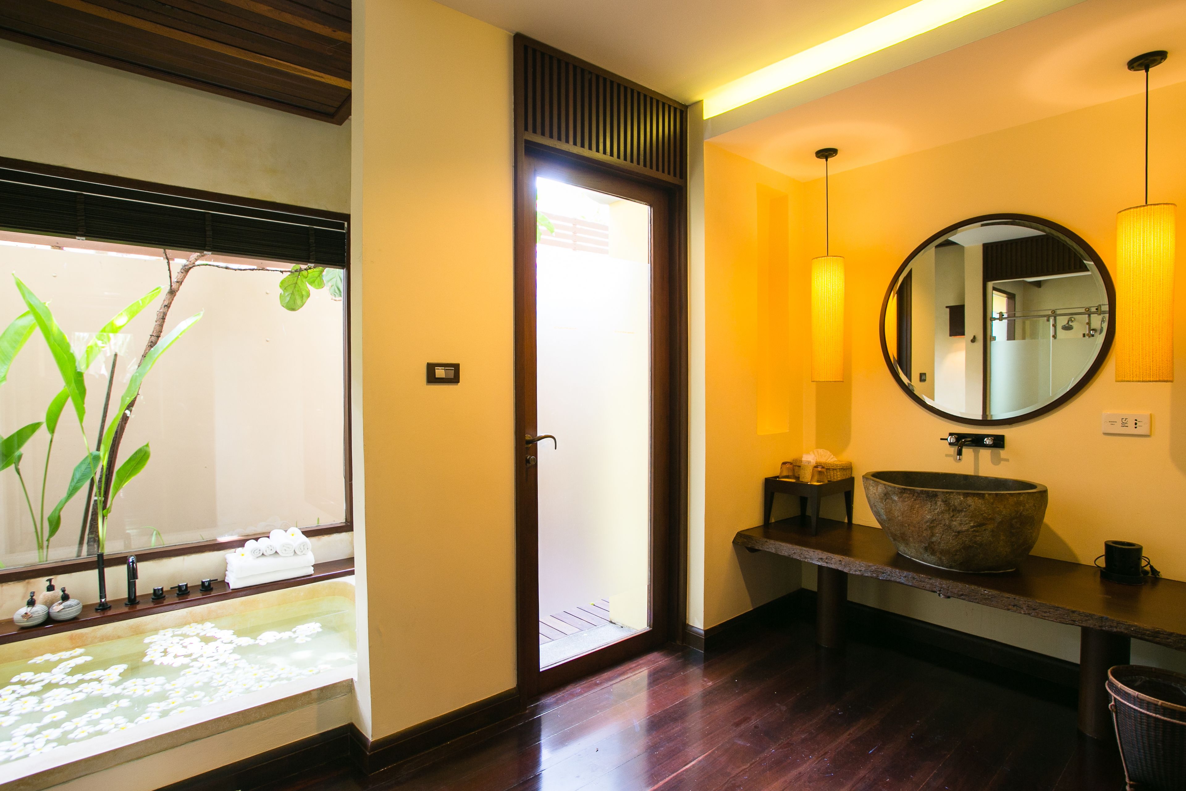 deluxe room | bathroom | separate bathtub and shower, rainfall showerhead, designer toiletries