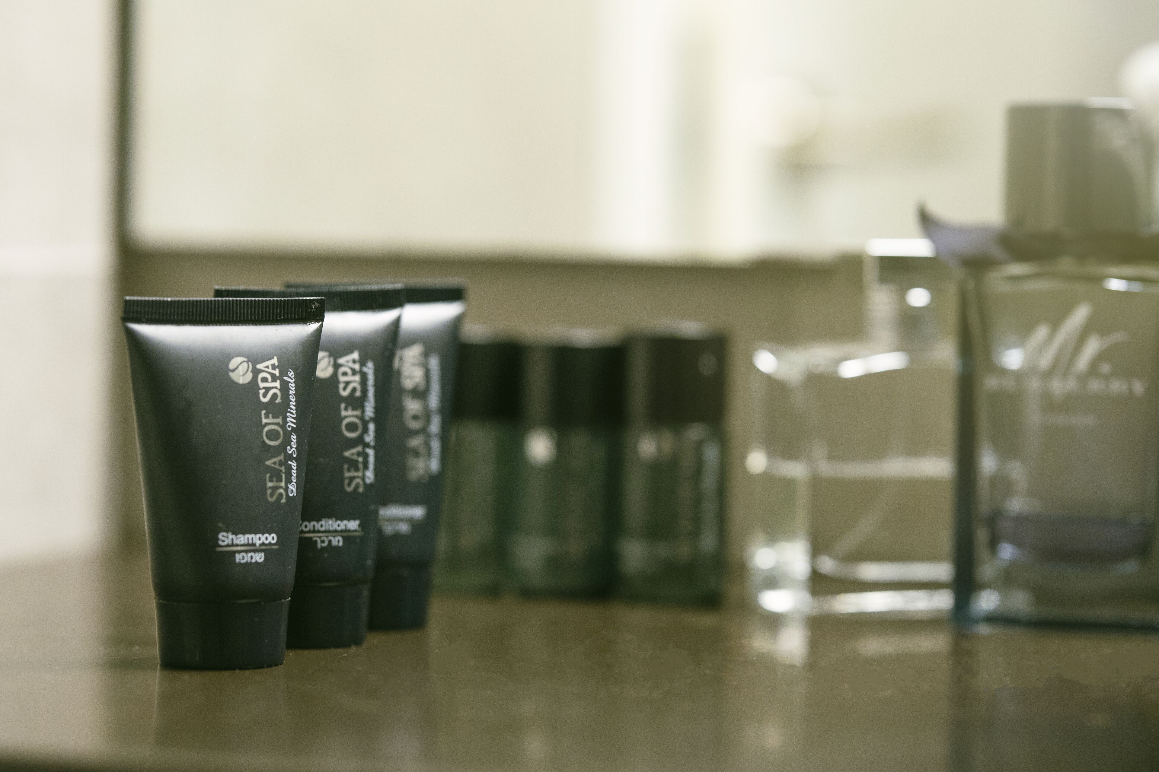 Three black tubes labeled 'Sea of Spa' on a countertop.