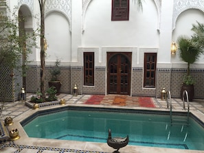 Outdoor pool, open 8:30 AM to 8:00 PM, pool umbrellas