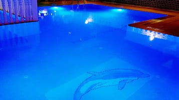 Seasonal outdoor pool, open 9:00 AM to 8:00 PM, pool umbrellas
