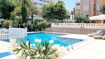 Seasonal outdoor pool, open 9:00 AM to 8:00 PM, pool umbrellas