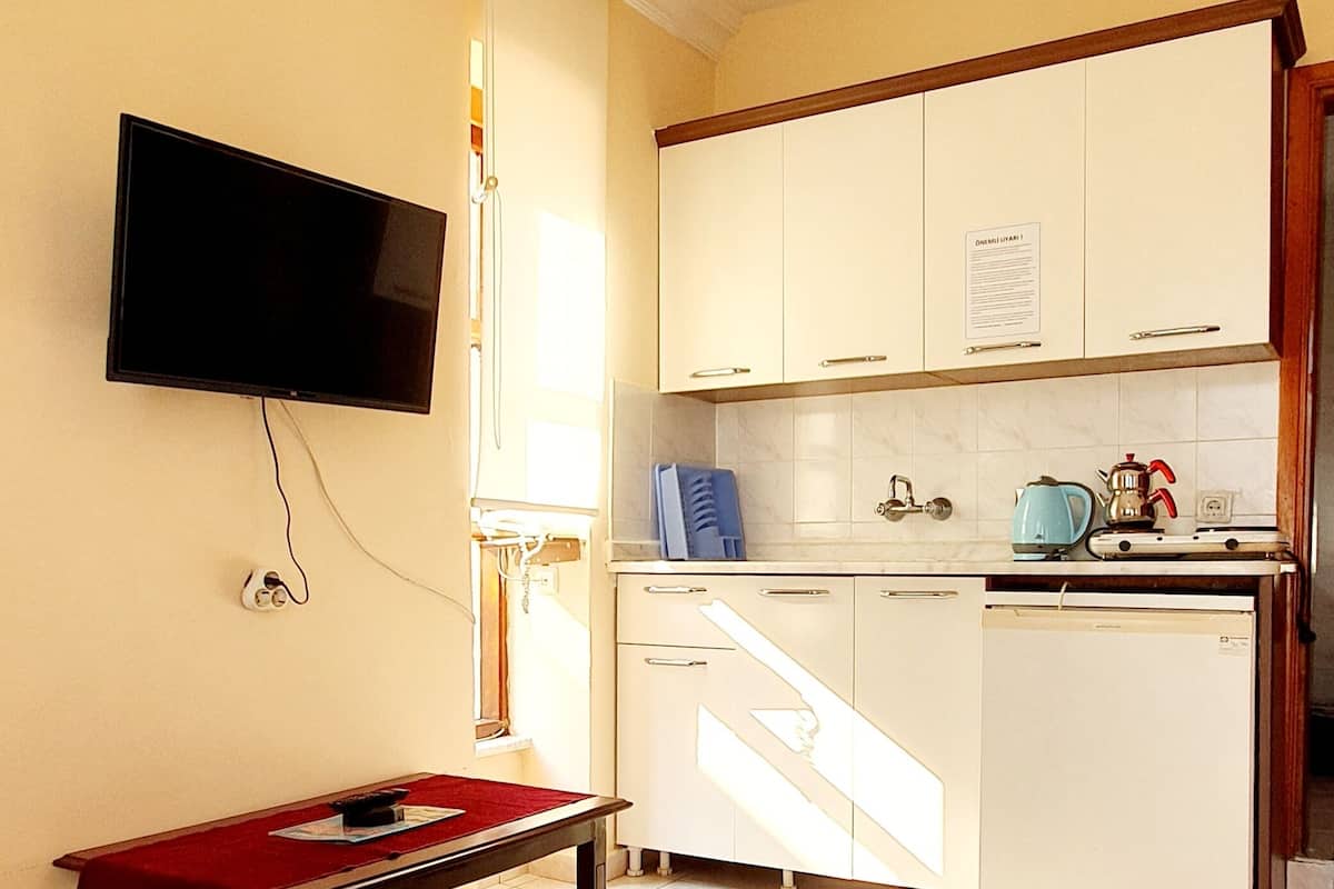 Apartamento standard, 1 quarto | 2 quartos, frigobar, individualmente mobiliados, escrivaninha