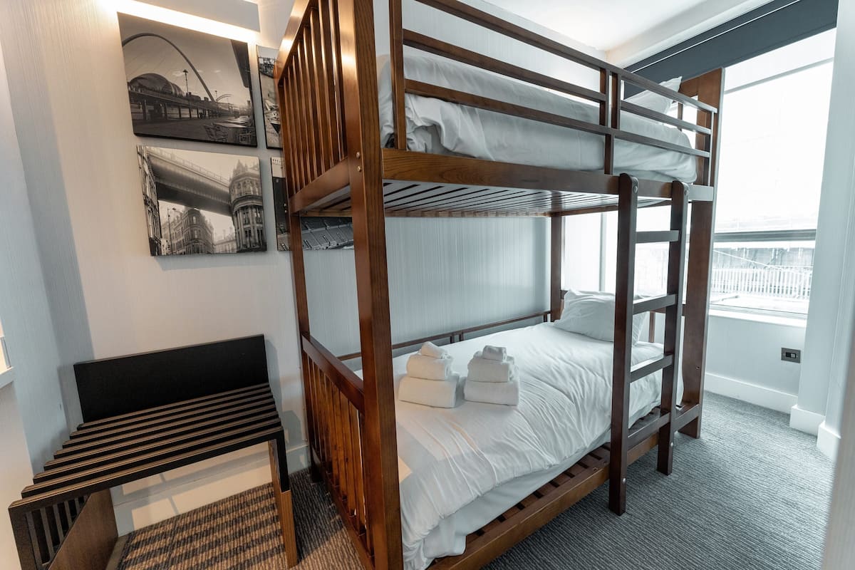 Family Suite, 1 King Bed, Bunk Beds, Kitchenette | Pillow-top beds, in-room safe, desk, blackout curtains