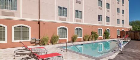 Outdoor pool, open 6:00 AM to 10:00 PM, sun loungers