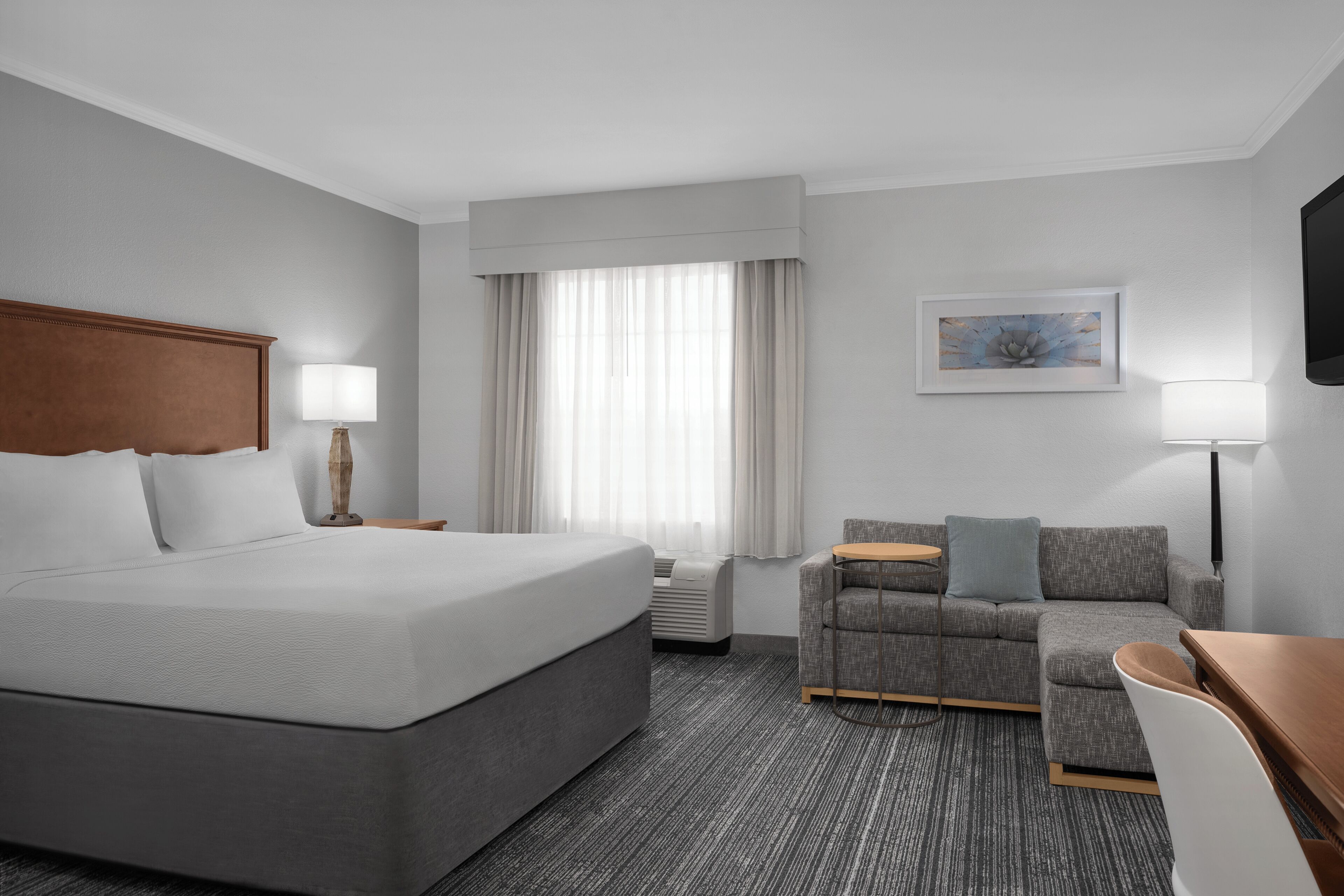 Premium bedding, desk, laptop workspace, blackout curtains