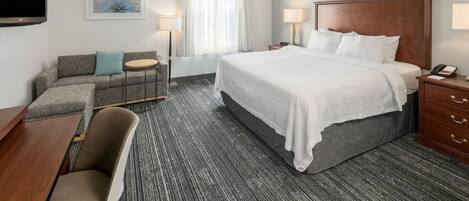 Premium bedding, desk, laptop workspace, blackout curtains