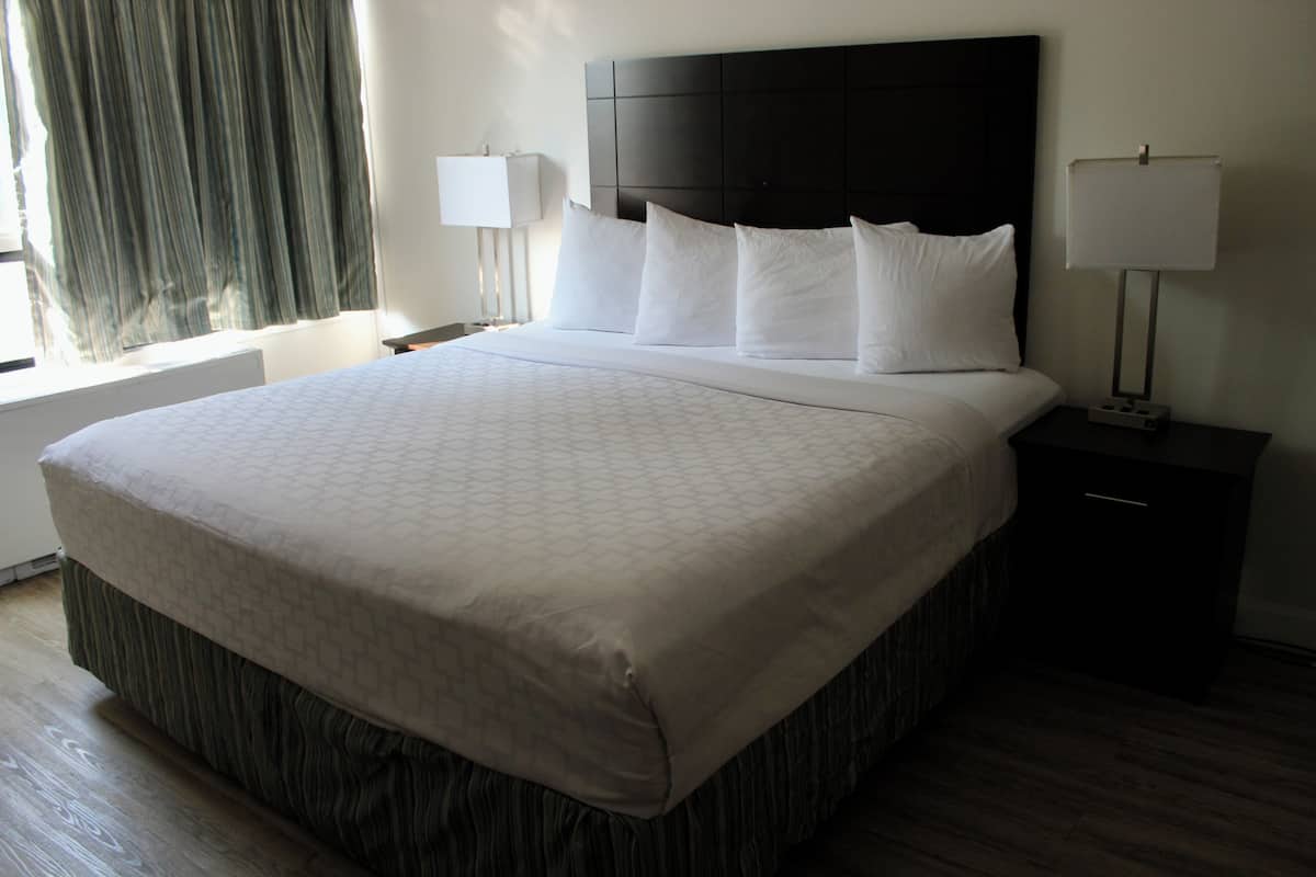 Suite, 1 King Bed, Non Smoking | Desk, iron/ironing board, cribs/infant beds, rollaway beds