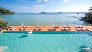 Outdoor pool, open 8 AM to 7 PM, pool umbrellas, pool loungers