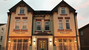 A two-story building with a sign reading "Pelham Lodge." - Pelham Lodge (Blackpool)