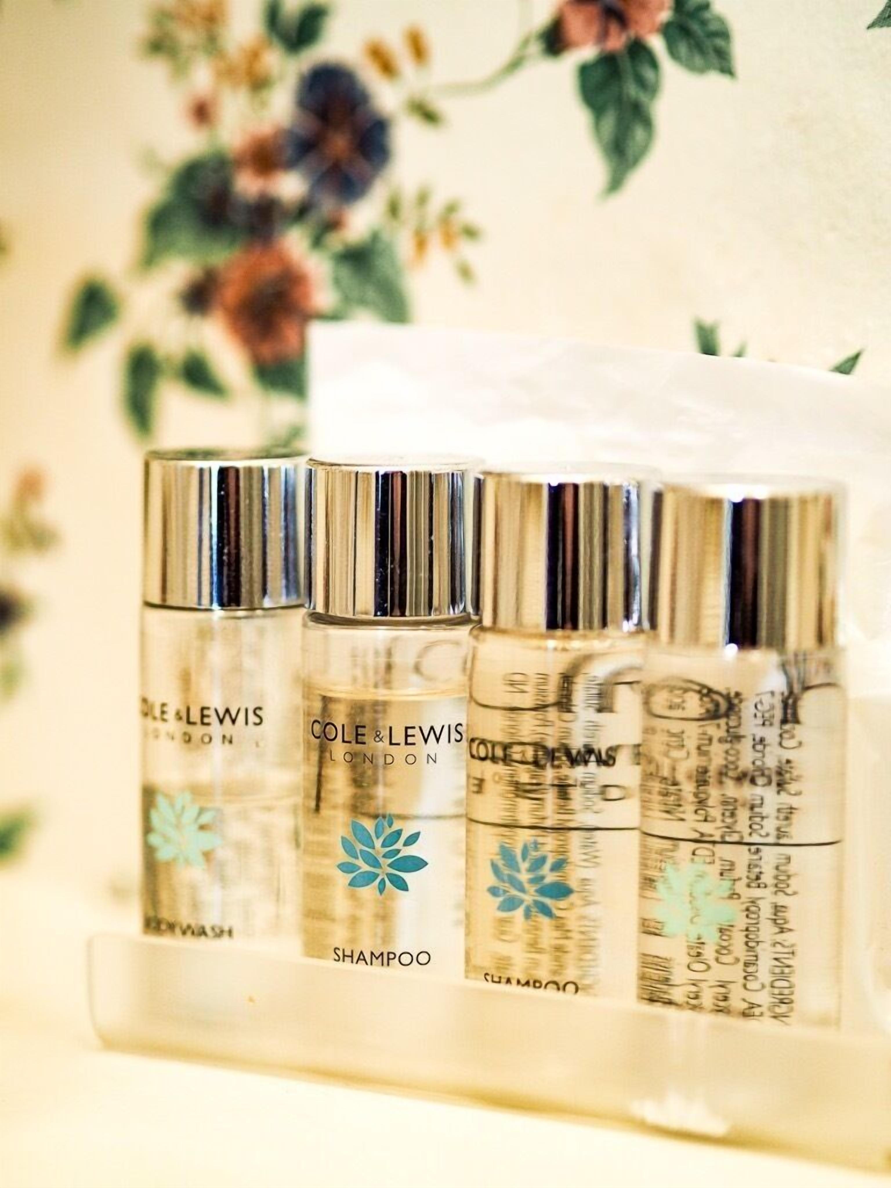 Three bottles of Cole & Lewis London shampoo in a clear plastic case.
