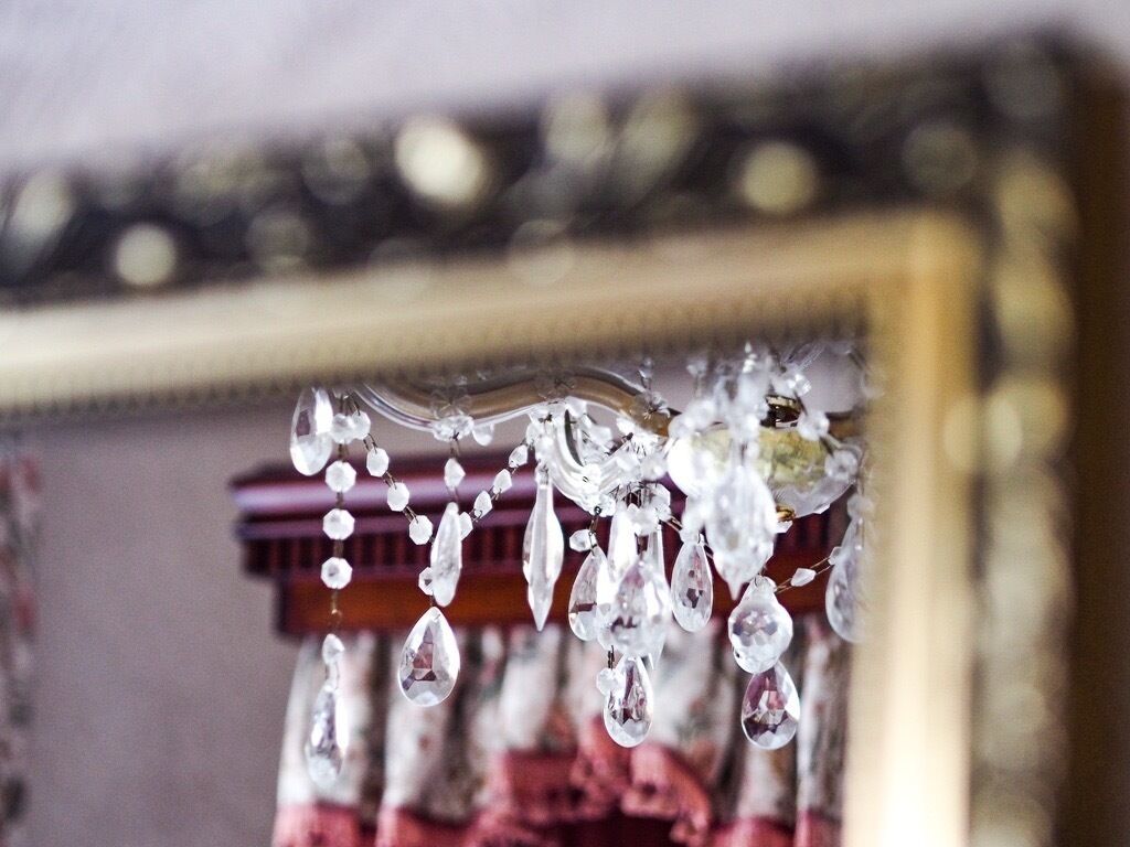 A chandelier with clear glass and crystal elements.