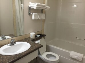 Deluxe Room, 1 Queen Bed, Kitchenette | Bathroom | Combined shower/tub, free toiletries, hair dryer, towels