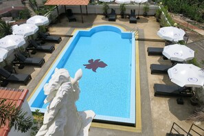 Outdoor pool, open 10:00 AM to 10:00 PM, pool umbrellas, pool loungers
