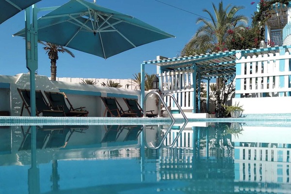 Seasonal outdoor pool, open 10:00 AM to 6:00 PM, pool umbrellas